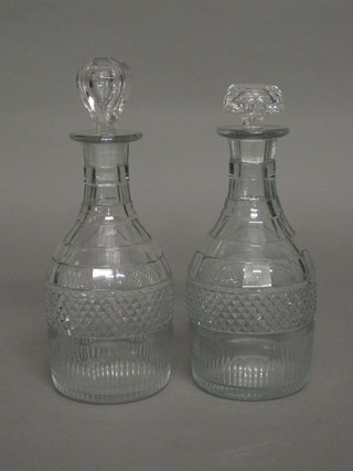 A pair of German cut glass decanters of club form with non  matching stoppers 8 1/2"