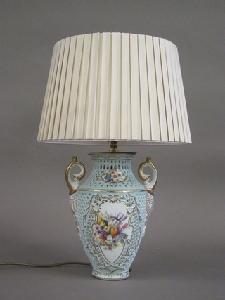 A pierced porcelain twin handled table lamp with floral  decoration 12"