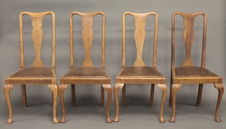 A set of 4 oak Queen Anne style slat back dining chairs with upholstered drop in seats, raised on cabriole supports