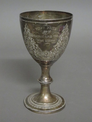 A Victorian embossed silver goblet shaped trophy cup, London 1875, 10 ozs  ILLUSTRATED