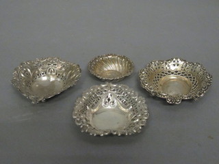A pair of Victorian pierced silver dishes, Birmingham 1886 and 1898 and 2 other silver dishes, 2 ozs