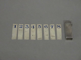 A white metal and enamelled 8 piece shooting gun selector numbered 1-8