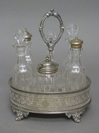 An oval silver plated 6 bottle condiment, raised on a pierced  silver plated frame