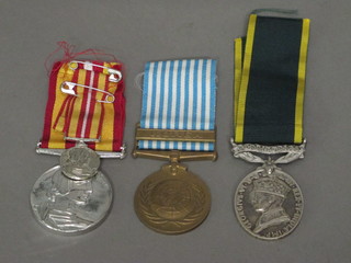 A George VI issue Territorial Efficiency medal, crudely named,  a Voluntary Medical Service medal and miniature and a United  Nations Korea medal