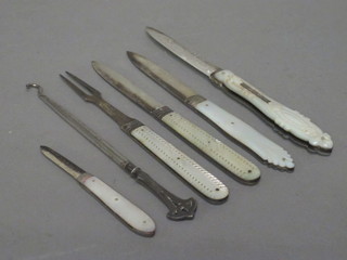 3 Victorian silver bladed folding fruit knives with mother of pearl grips, do. pocket knife, do. fork and a silver button hook