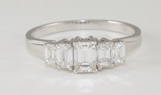 A lady's 18ct white gold dress ring set 5 baguette cut diamonds, approx 1.05ct
