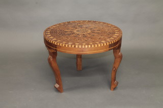 An Eastern inlaid "olive wood" occasional table, raised on  cabriole supports 24"