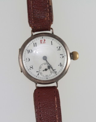 A wristwatch by Rode contained in a Continental silver case