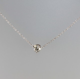 A solitaire diamond pendant hung on a fine gold chain, approx 0.75ct