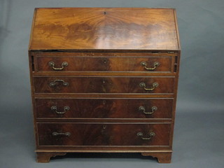 A 19th Century walnut bureau the fall front revealing a fitted interior with numerous drawers above 4 long drawers with brass  swan neck handles, on bracket feet 38"