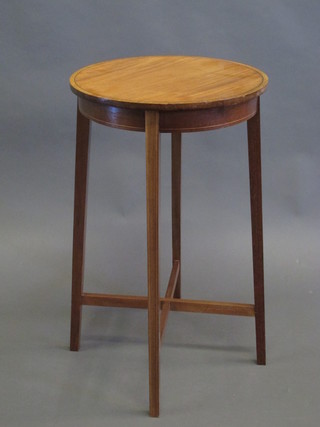 An Edwardian inlaid bleached mahogany circular occasional table  raised on tapering supports 15"