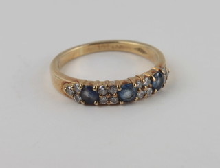 A lady's 18ct gold dress ring set sapphires and diamonds