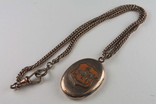 A gilt metal locket hung a sonic pendant, 1 side marked with arch  and 2 1/2 and the other side with mounted figure on a horse  1690, hung on a gilt chain