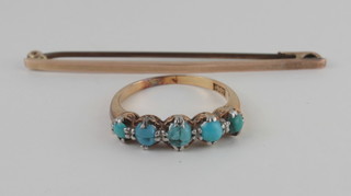 A lady's gold dress ring set turquoise and a gold tie pin
