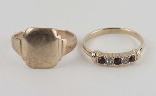 A lady's gold dress ring set white and red stones together with a  signet ring
