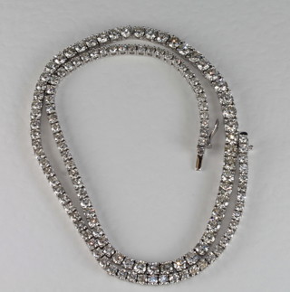 A lady's 18ct white gold Riviere necklace set approximately 125 graduated diamonds, approx. 19cts, with Insurance Certificate,  ?12,000-14,000
