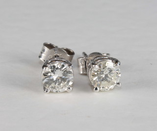 A pair of circular diamond ear studs, approx 1.04ct