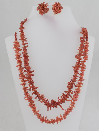 2 strings of coral beads and a pair of coral earrings