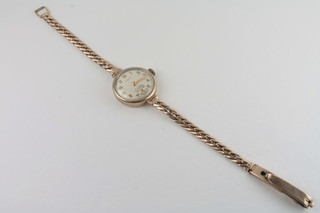 A lady's Cyma gold wristwatch with integral gold bracelet
