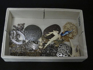 A collection of ivory and silver brooches, gilt chains etc