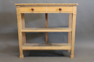 A Victorian pine 2 tier buffet, the upper section fitted 2 short drawers with turned handles 45"