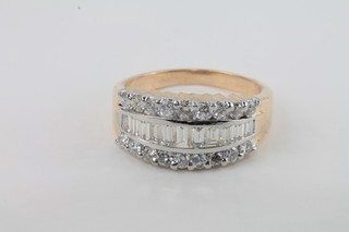 A lady's yellow gold dress ring set baguette cut diamonds  supported by diamonds