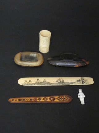 A carved ivory paper knife decorated mermaids, a carved ivory die thrower, a horn snuffer, a tortoiseshell finished nail buffer, a  Tonbridge ware paper knife and a frozen Charlotte doll