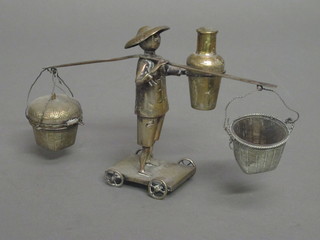 An Eastern white metal condiment in the form of a standing  bearer