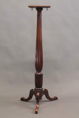 A 19th Century square mahogany torchere raised on a turned and  reeded column with tripod base