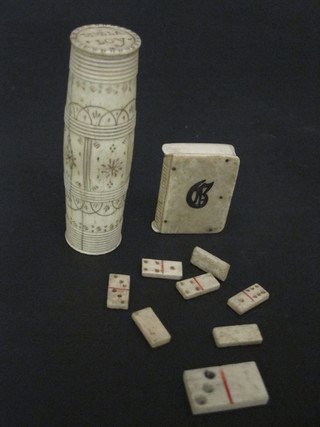 A turned and carved ivory needle case, a carved ivory vesta case and a small collection of dominoes