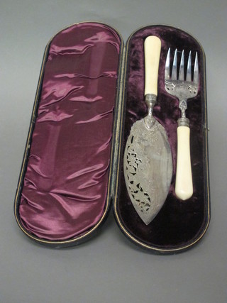 A pair of pierced silver plated fish servers, cased,