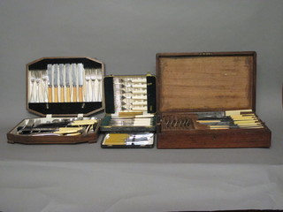 An oak canteen box containing a part Old English pattern canteen, 1 other oak canteen box with part canteen, a set of 6 fish  knives and forks and a set of 6 tea knives, cased