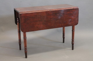 A 19th Century mahogany drop flap dining table, raised on  turned supports 36"
