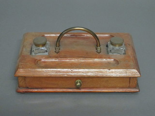 A 19th Century honey oak standish fitted a drawer and 2 glass  ink wells, 11"