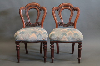 A pair of 19th Century mahogany Admiralty tulip back chairs