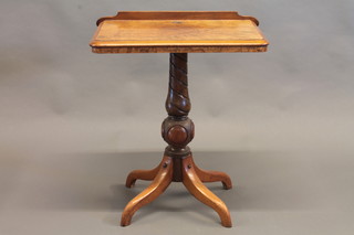 A Victorian figured walnut rectangular reading table, raised on spiral turned column and tripod base 23"