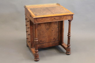 A Victorian walnut Davenport with brass three-quarter gallery, fitted a rising stationery box, the pedestal fitted 2 brushing slides  and 4 long drawers, 26"  ILLUSTRATED