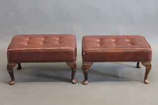 A pair of rectangular mahogany stools upholstered in brown rexine, raised on cabriole supports 22"