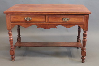 An Edwardian walnut side table fitted 1 long drawer, raised on turned supports 42"