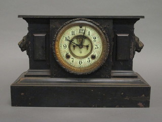 A 19th Century American 8 day striking mantel clock with  visible escapement contained in an iron architectural case