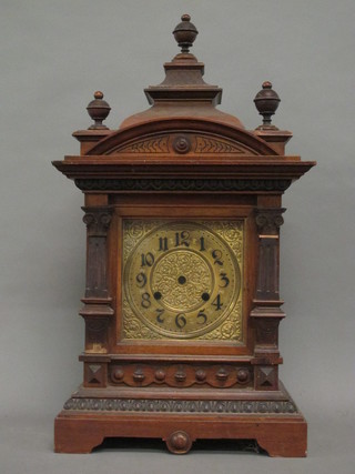 A 19th Century carved walnut clock case containing a 6" square brass dial with Arabic numerals