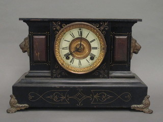 An American 8 day striking mantel clock with paper dial contained in an iron architectural case by the Ansonia Clock Co.