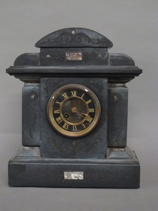 A 19th Century French 8 day striking mantel clock with Roman numerals contained in a black marble architectural case
