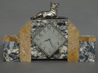 An Art Deco 3 piece clock garniture comprising mantel clock with diamond shaped dial and Arabic numerals, contained in a 2  colour marble case, surmounted by a spelter figure of a reclining  Alsatian together with a pair of side vases