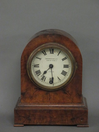 A 19th Century mantel clock the painted dial marked Camere  Cuss & Co, contained in arched walnut case