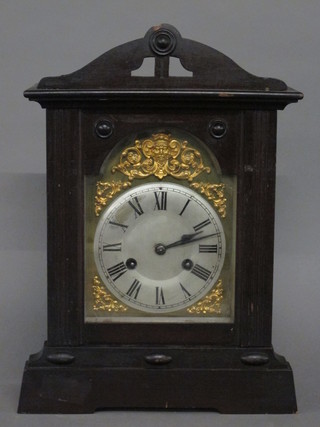 A 19th Century striking mantel clock with 6" heart shaped dial contained in a mahogany case