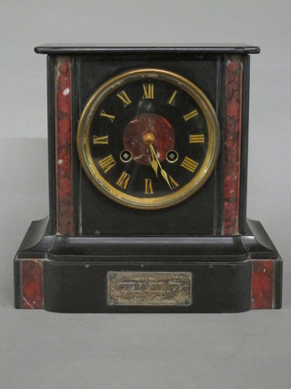 A Victorian French 8 day striking mantel clock with Roman  numerals contained in a 2 colour marble case