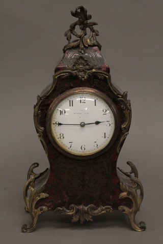 A 19th Century French 8 day mantel clock with enamelled dial  and Arabic numerals contained in a shaped boulle and gilt metal  mounted case 12"  ILLUSTRATED