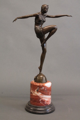 An Art Deco style bronze figure of a dancing girl, raised on a cylindrical marble base 23"