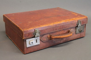 A leather suitcase with chrome fittings 17"
